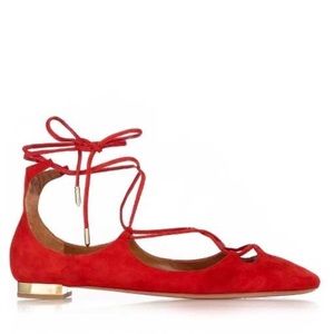 Aquazzura dancer flats with gold heel.